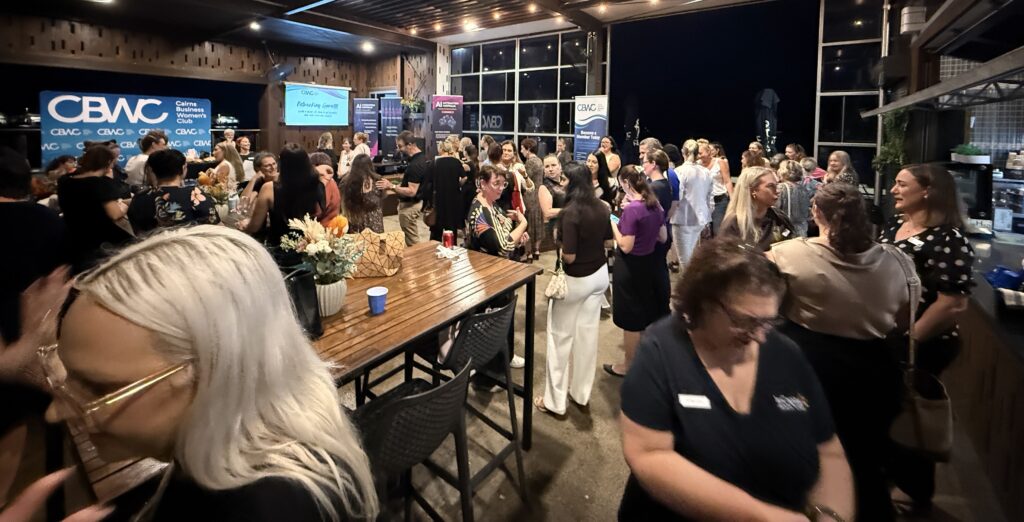 Business owners networking at a professional event in Cairns, highlighting the role of relationships in business growth